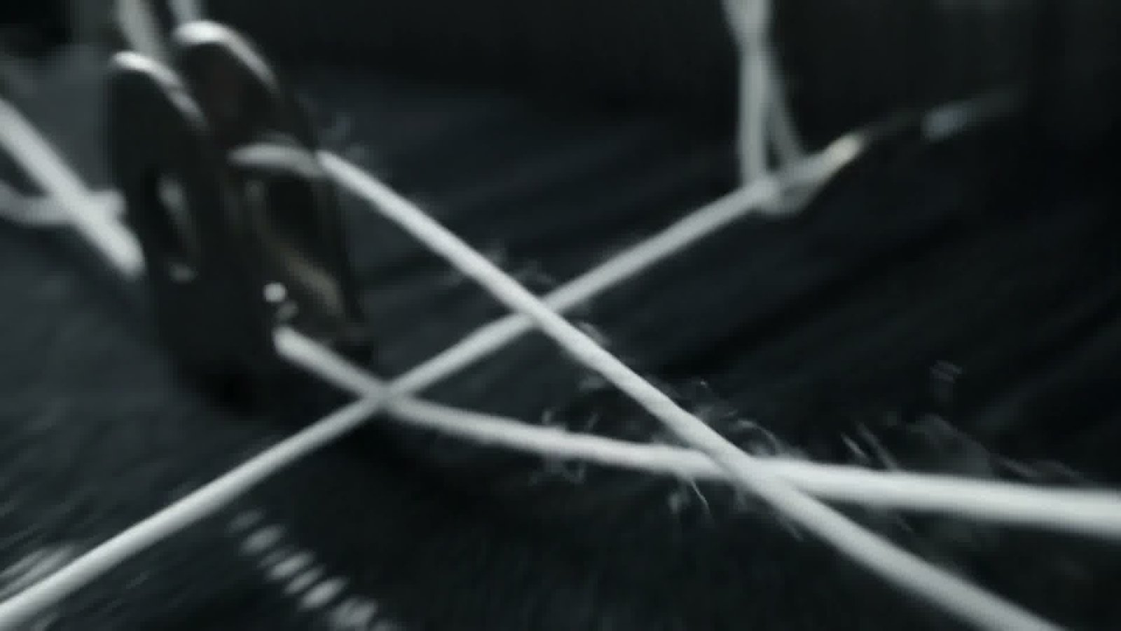 White threads crossing like running water